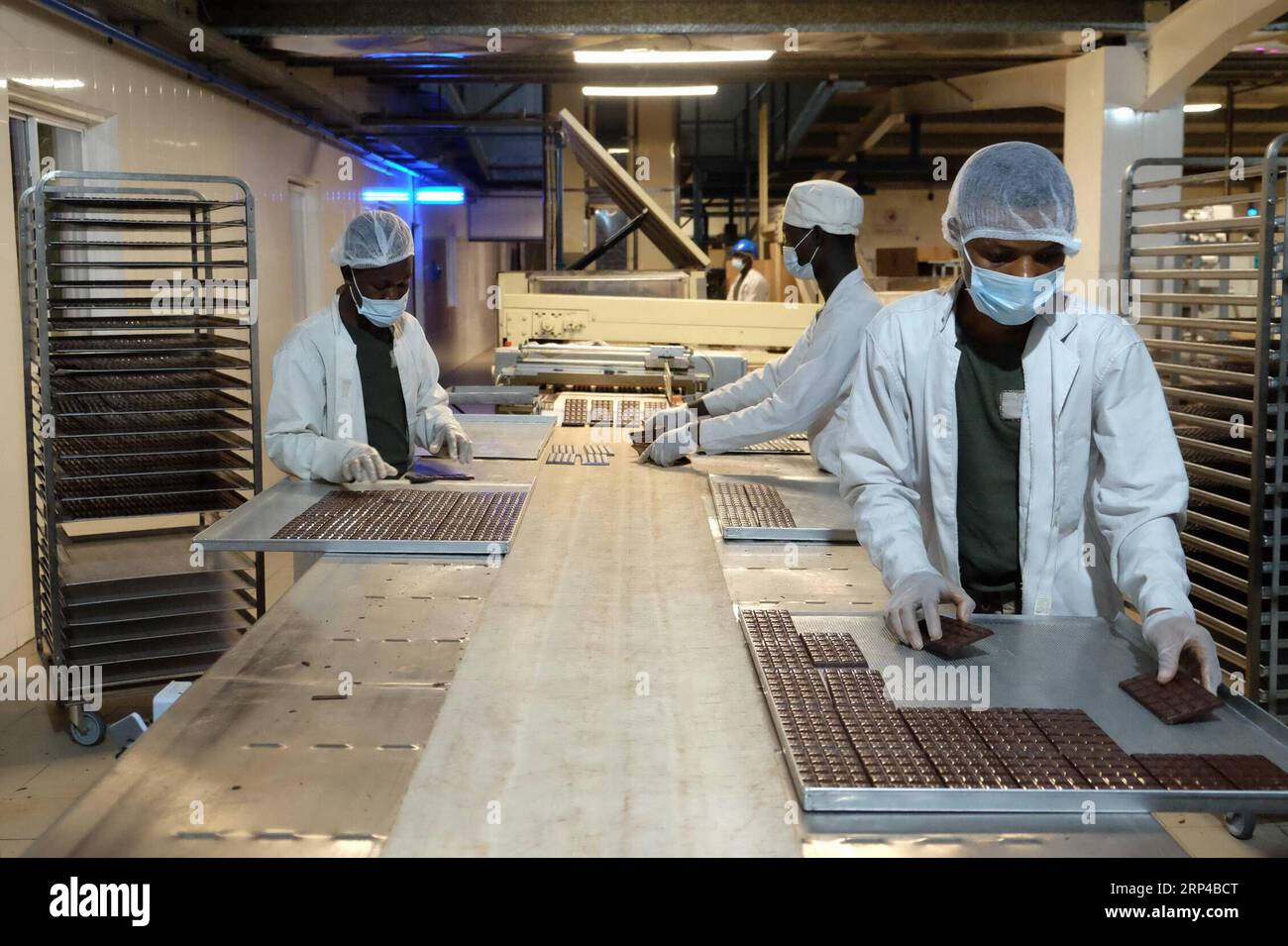 Ghana industrial workers factories operating at night symbolising 24-hour economy concept